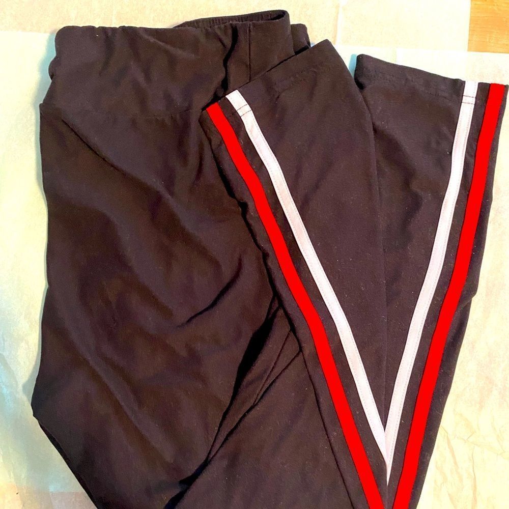 Black leggings with white and red stripe